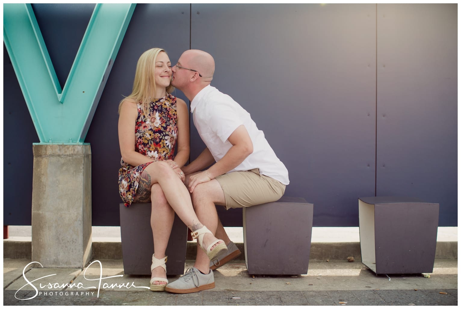 Fountain Square Indianapolis Photography Engagement Session male kissing female's cheek