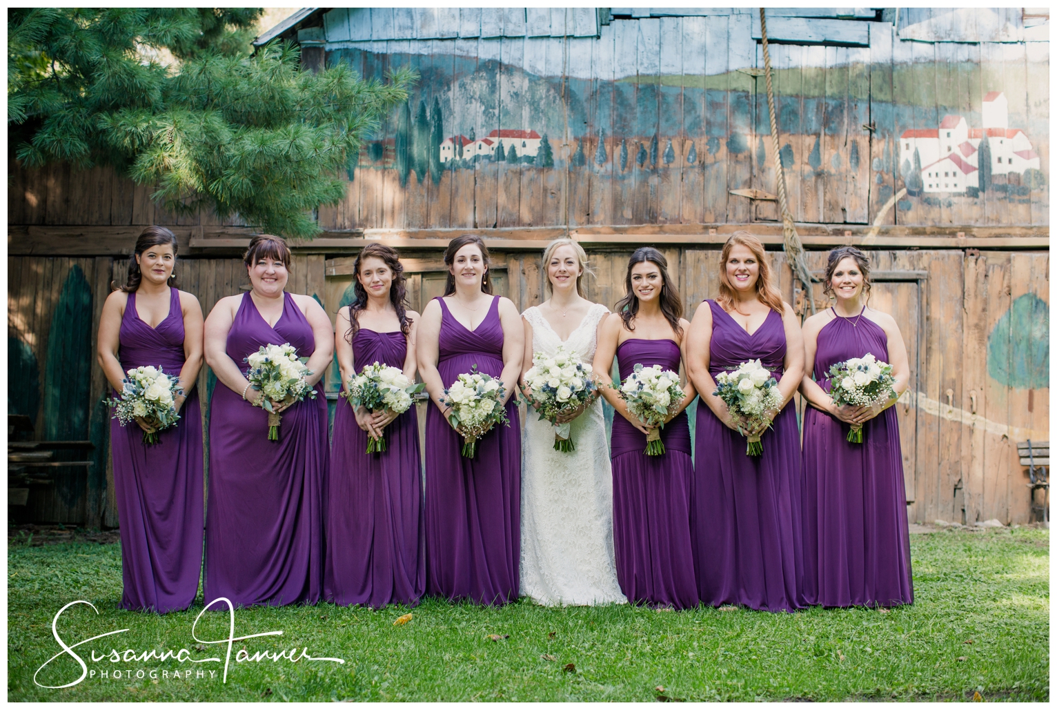 Indianapolis Outdoor Wedding, bride and bridesmaids standing in straight line in front of barn
