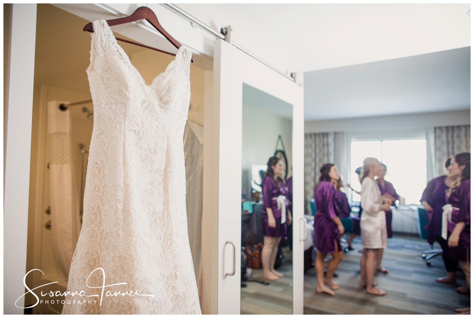 Indianapolis Outdoor Wedding, wedding dress hanging from doorway while bridesmaids are in distance