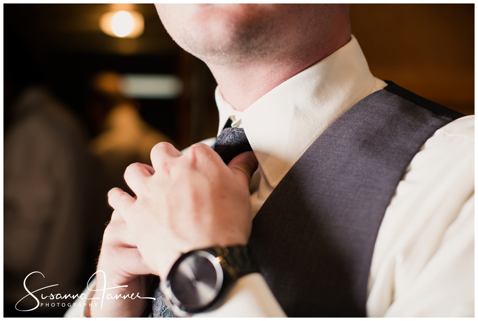 Indianapolis Outdoor Wedding, close up of groom cinching up tie