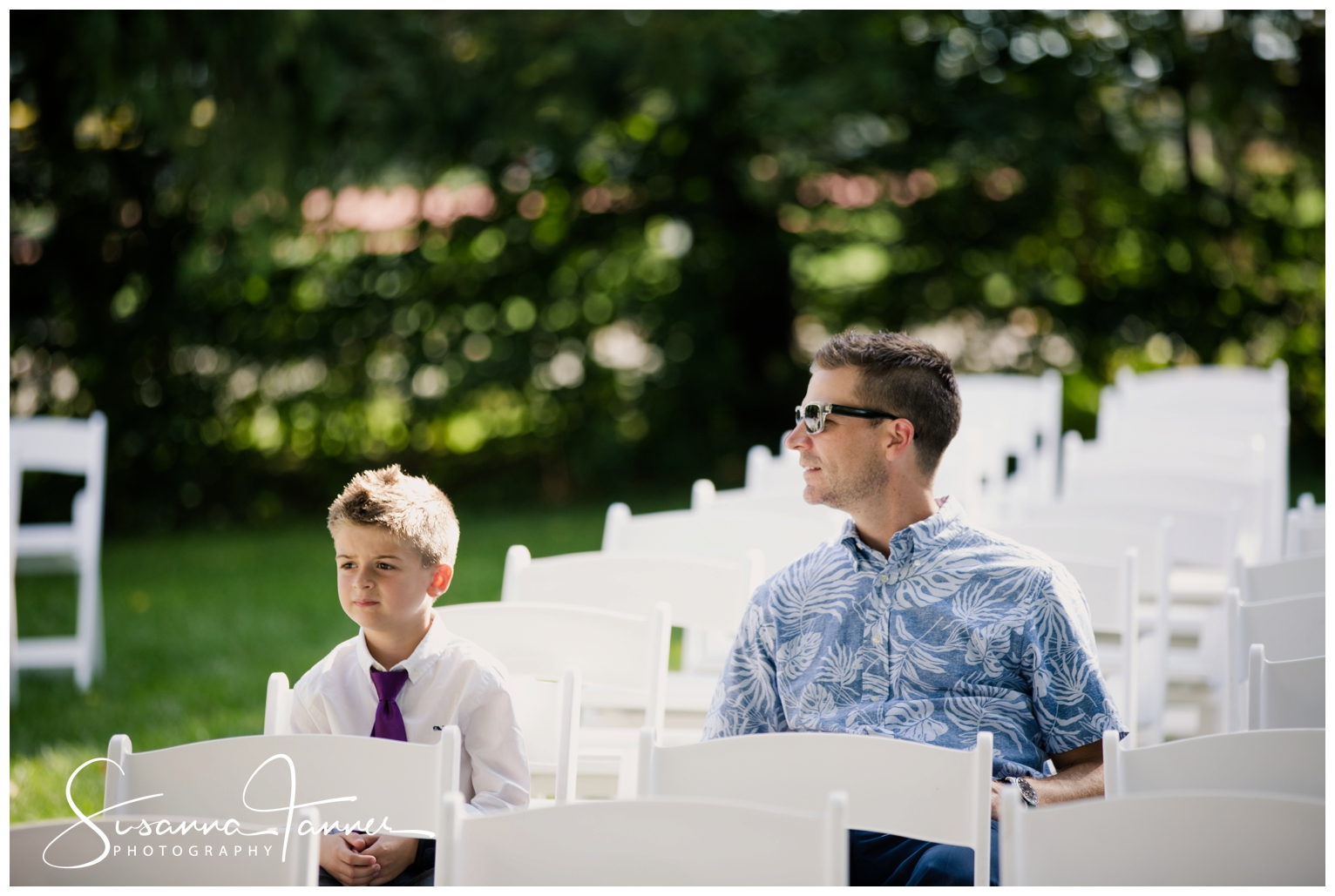 Indianapolis Outdoor Wedding, father and son waiting for wedding to begin surrounded by white empty chairs