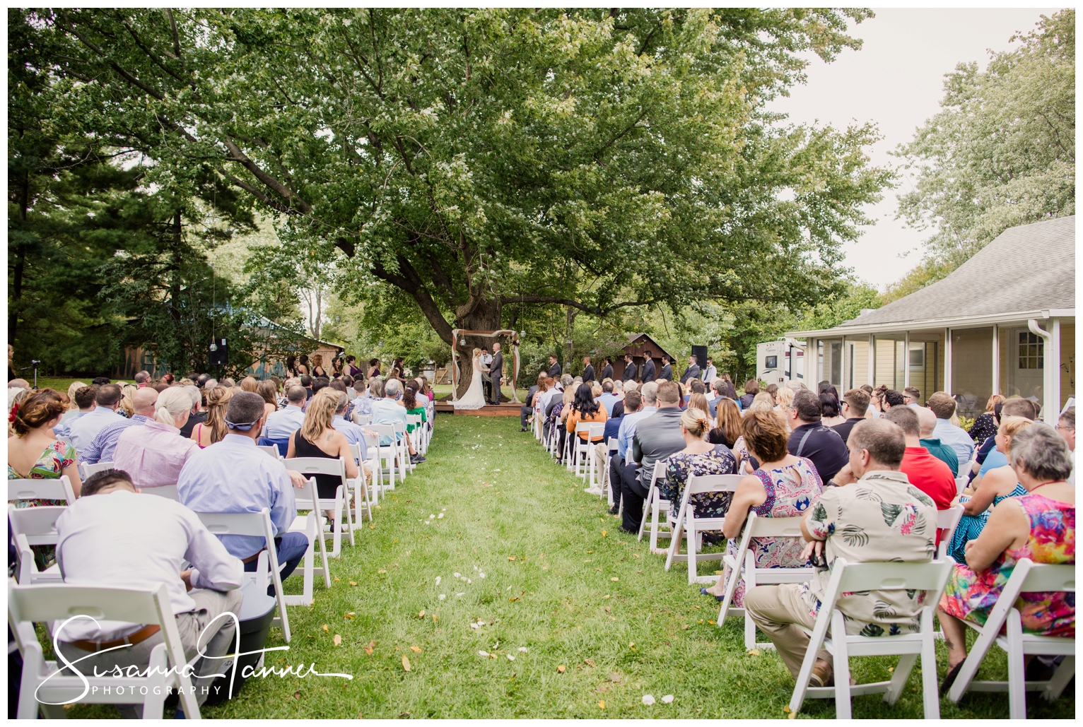 Indianapolis Outdoor Wedding, Guests watching bride and groom saying vows