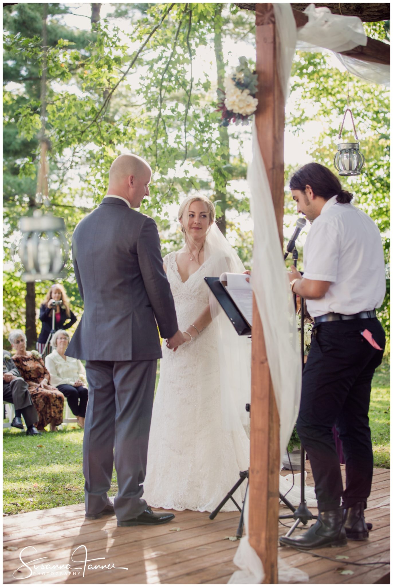 Indianapolis Outdoor Wedding, bride looking at officiator 