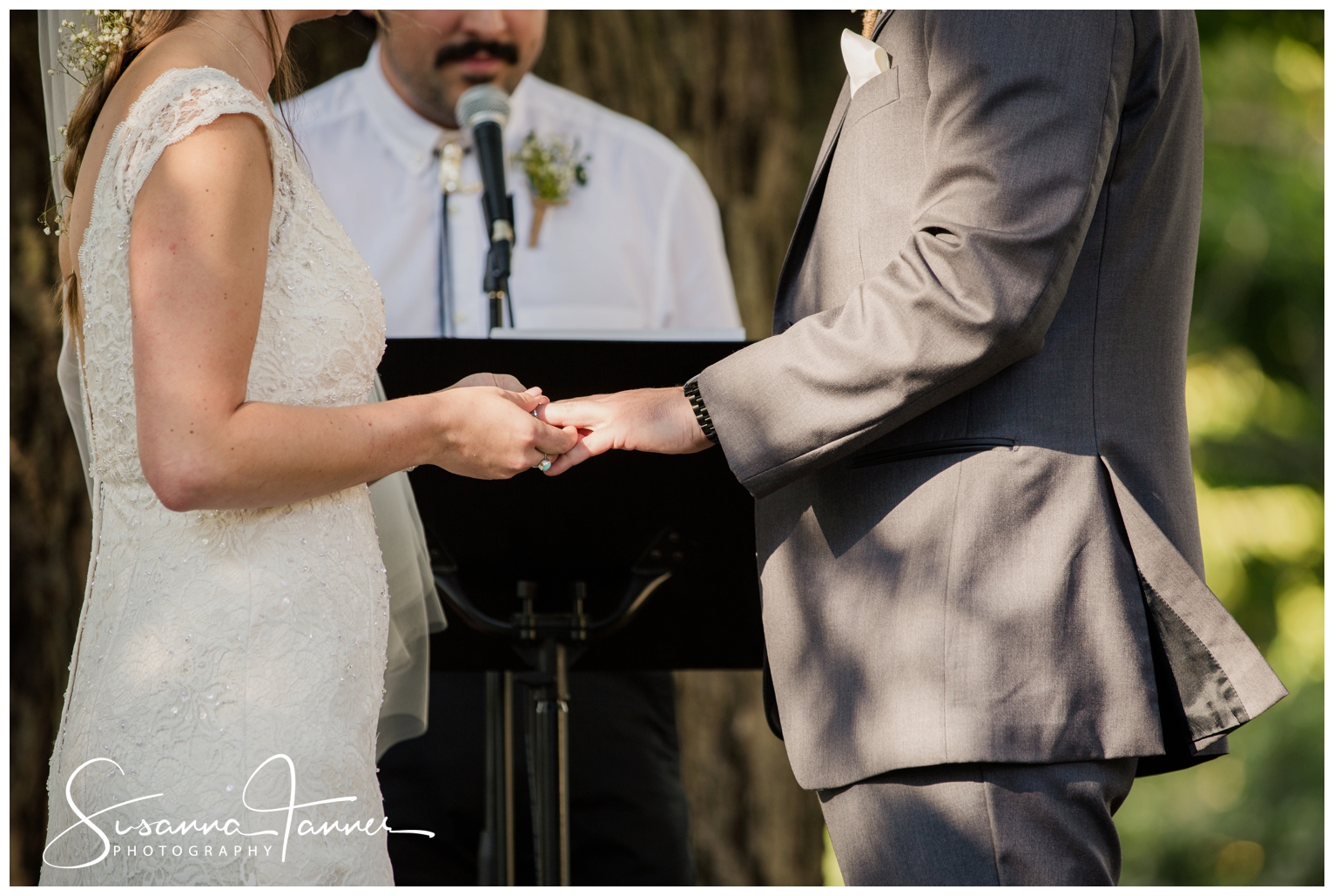 Indianapolis Outdoor Wedding, bride putting ring on grooms hand