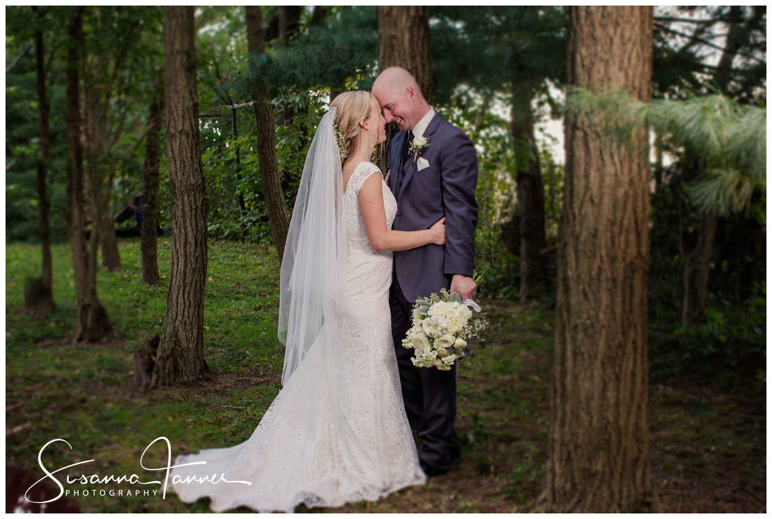 Indianapolis Outdoor Wedding, bride and groom hugging surrounded by pine trees