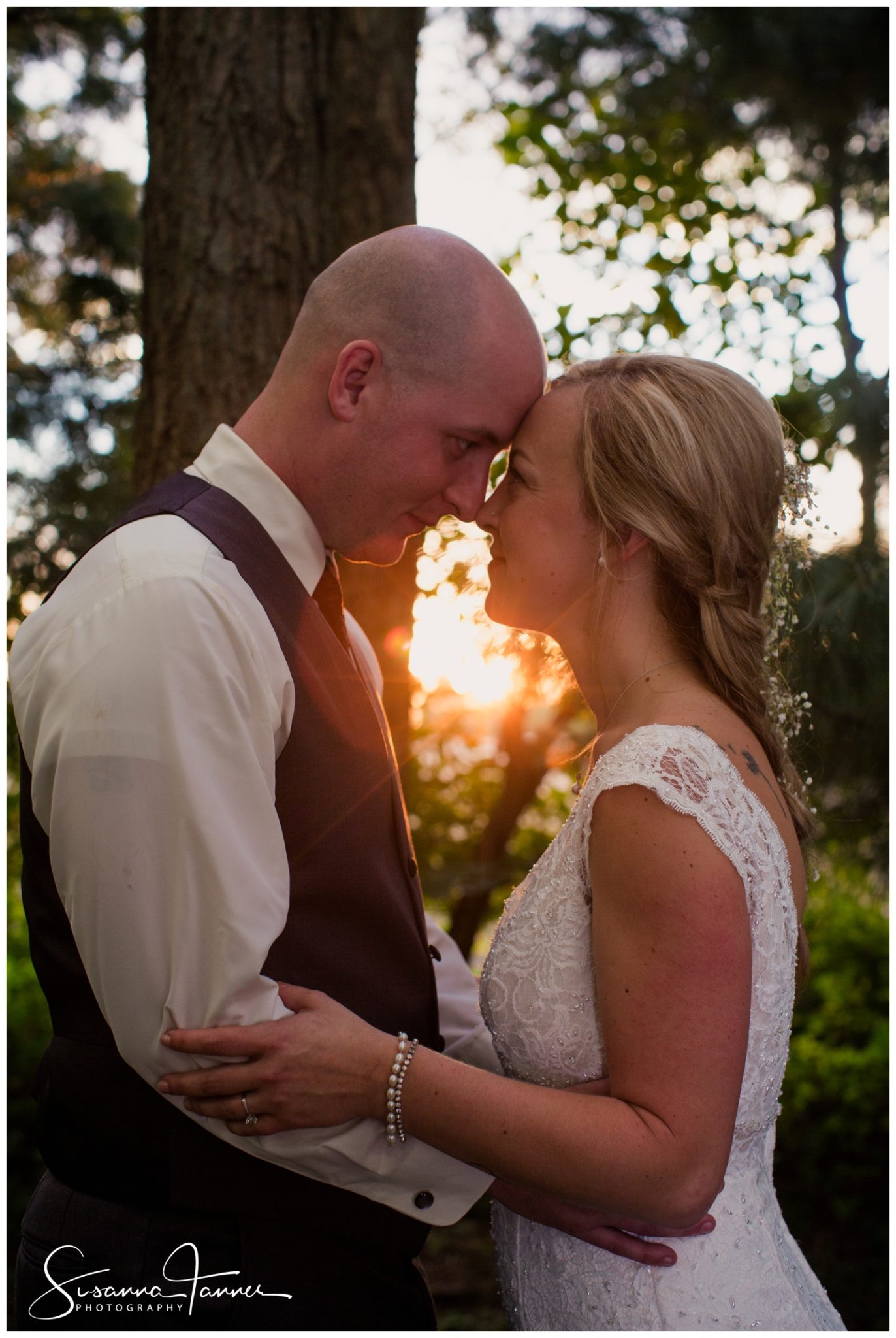 Indianapolis Outdoor Wedding, bride and groom portrait with sunset behind them casting a nice orange glow