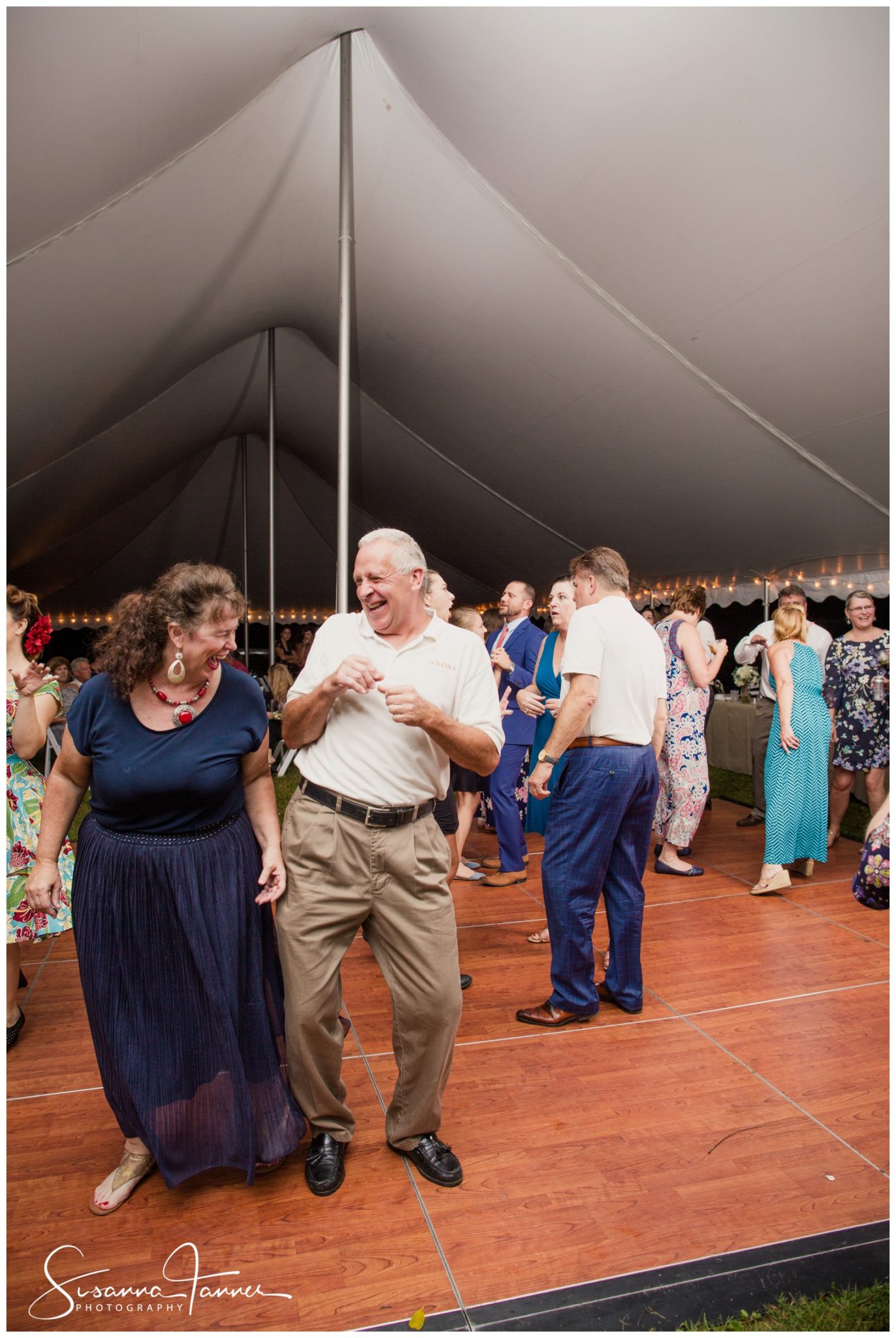 Indianapolis Outdoor Wedding, older couple happily dancing with each other, bumping at the hip and smiling