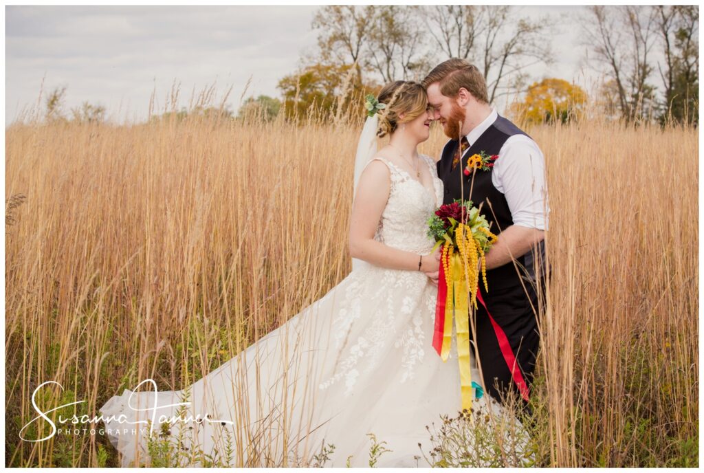 Cope Environmental Center wedding, Richmond, Indiana wedding, bride and groom portrait in field of tall grasses