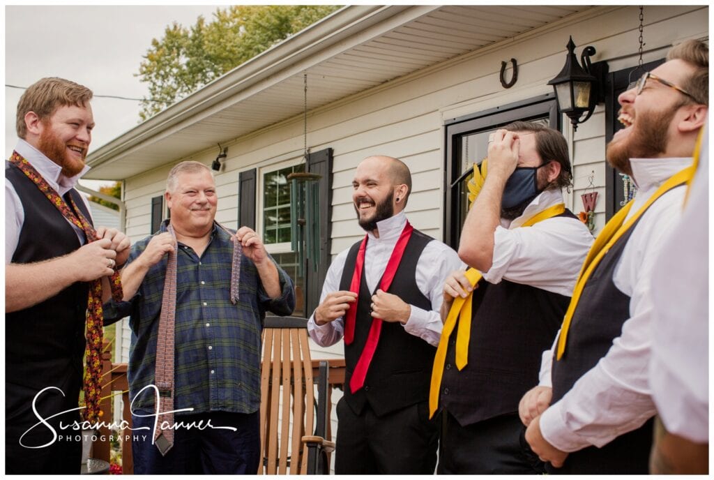 Cope Environmental Center wedding, Richmond, Indiana wedding, groomsmen tying their ties