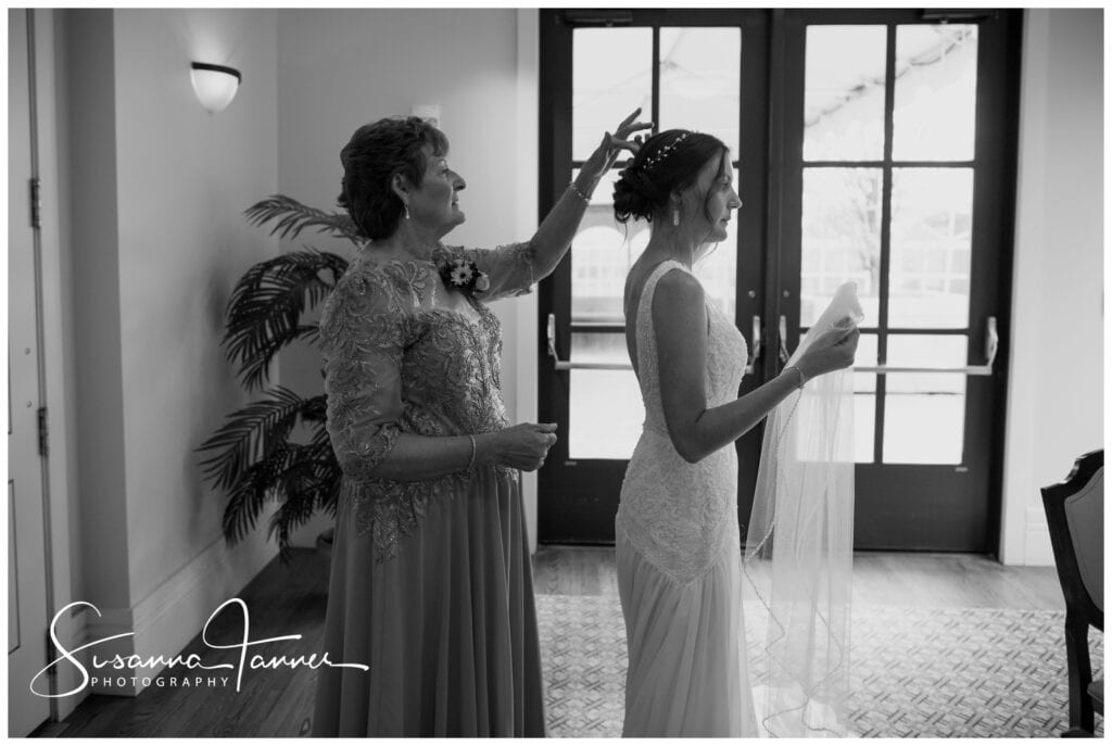 Taft Museum of Art, Cincinnati Ohio wedding, mother helping bride put on her veil. Profile shot in black and white. 
