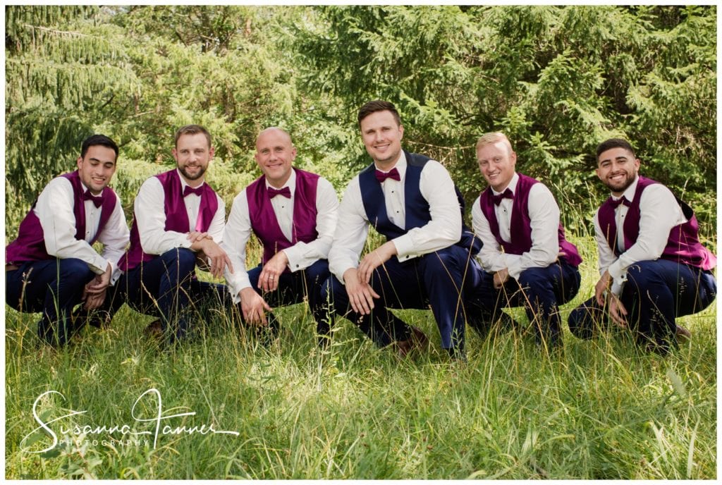 Cope Environmental Wedding Photography, Richmond Indiana, groomsmen and groom kneeling in the tall grass
