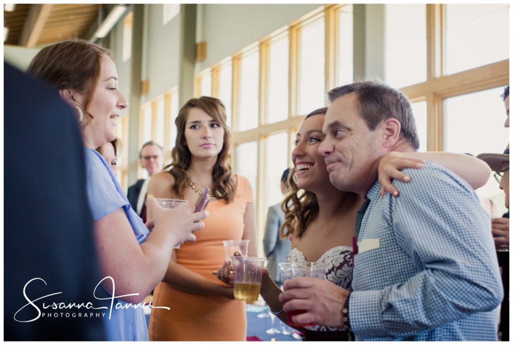 Cope Environmental Wedding Photography, Richmond Indiana, guests having fun with arm around shoulder