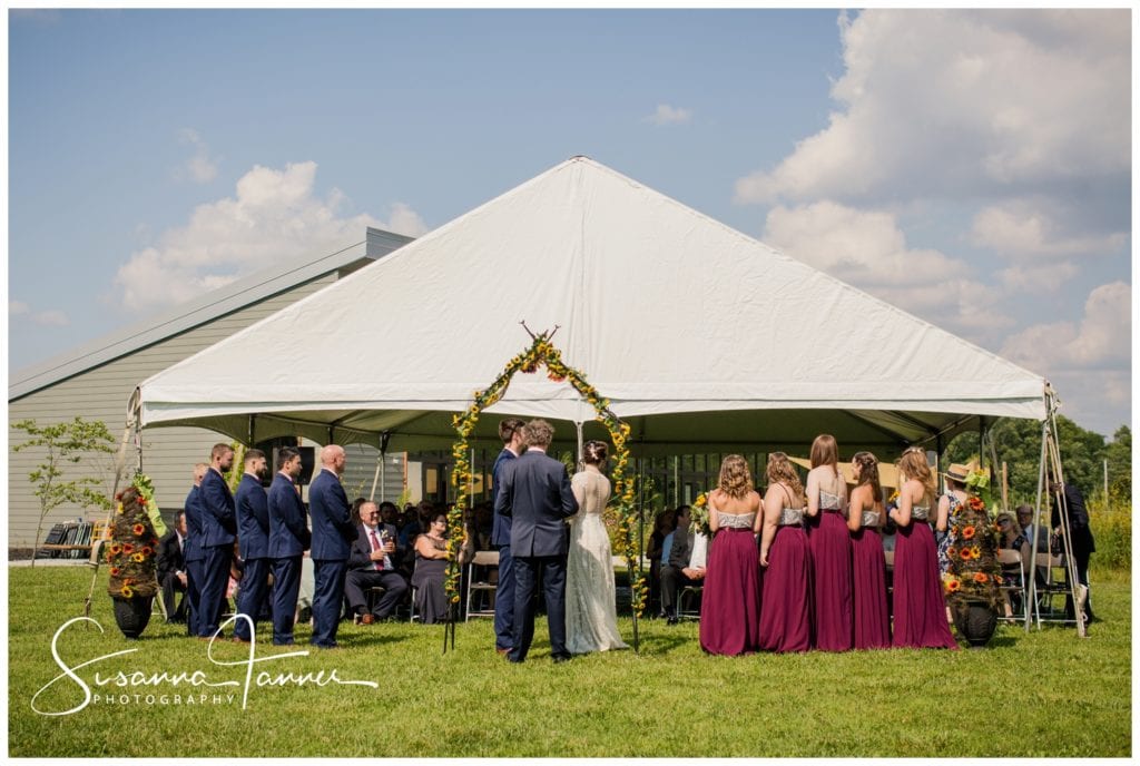 Cope Environmental Wedding Photography, Richmond Indiana, wide shot of wedding party and ceremony tent