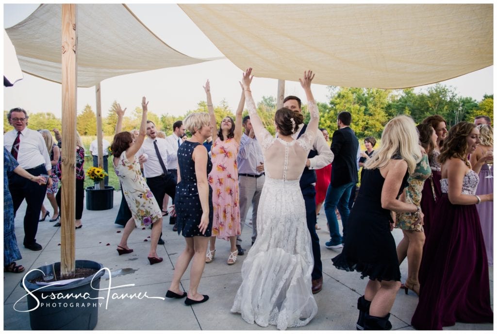 Cope Environmental Wedding Photography, Richmond Indiana, people dancing with their arms in the air