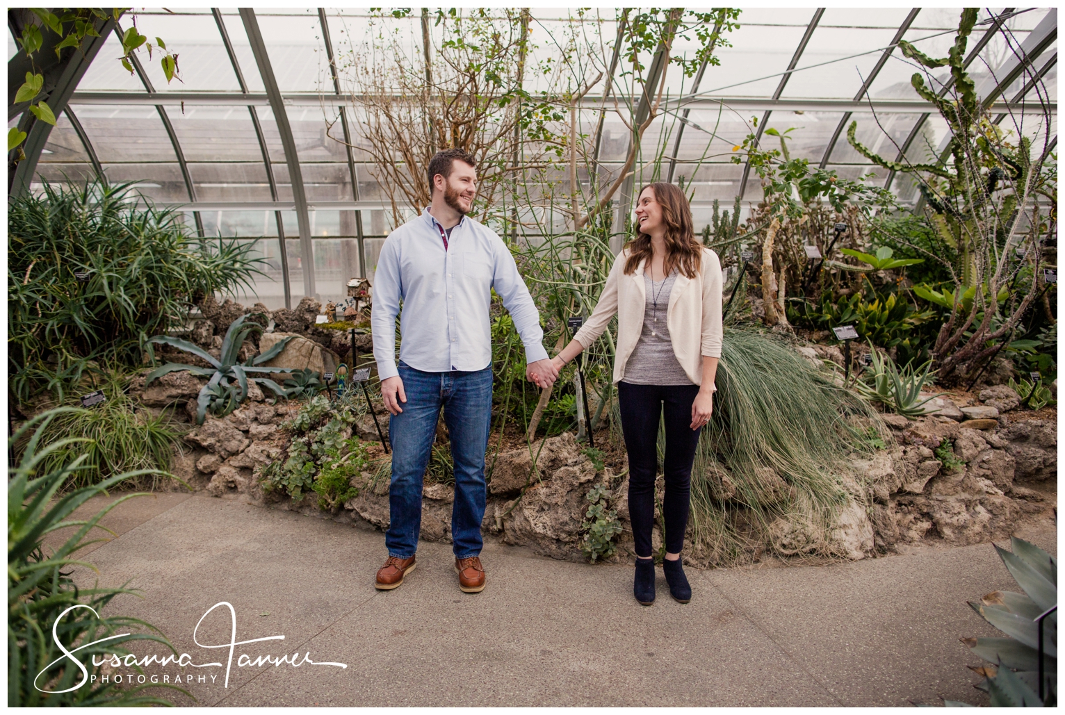 Cincinnati Krohn Conservatory Engagement Photography, couple standing next to each other ,holding hands and smiling at each other
