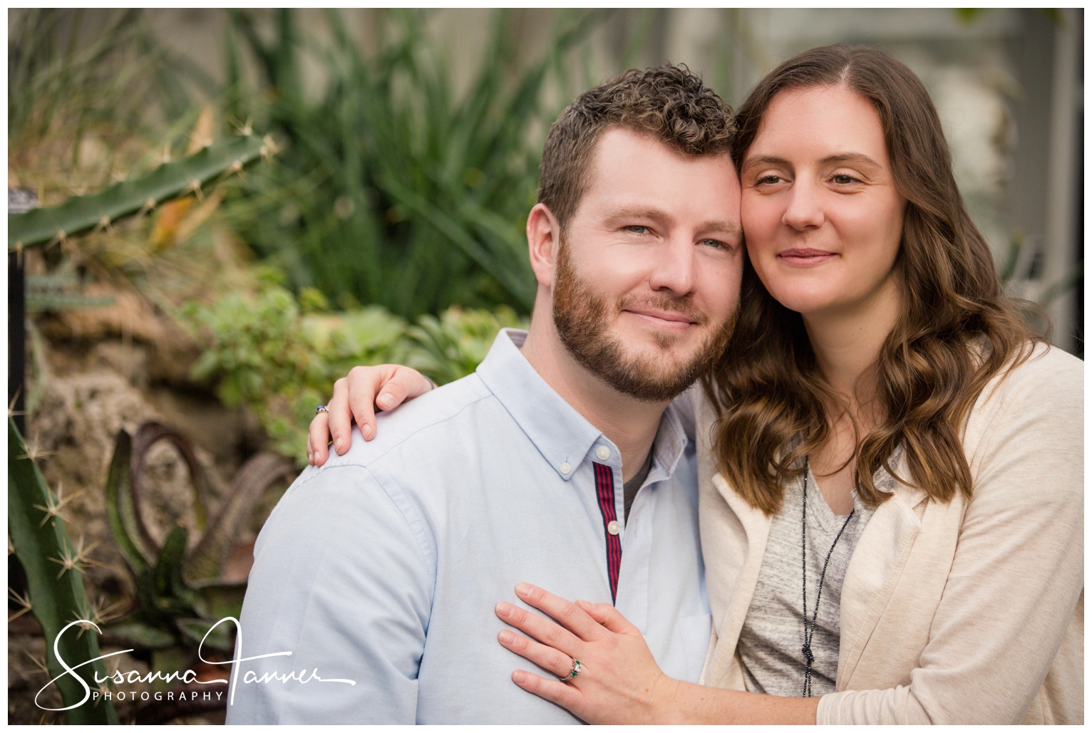 Cincinnati Krohn Conservatory Engagement Photography, close up of couple sitting close and smiling at camera