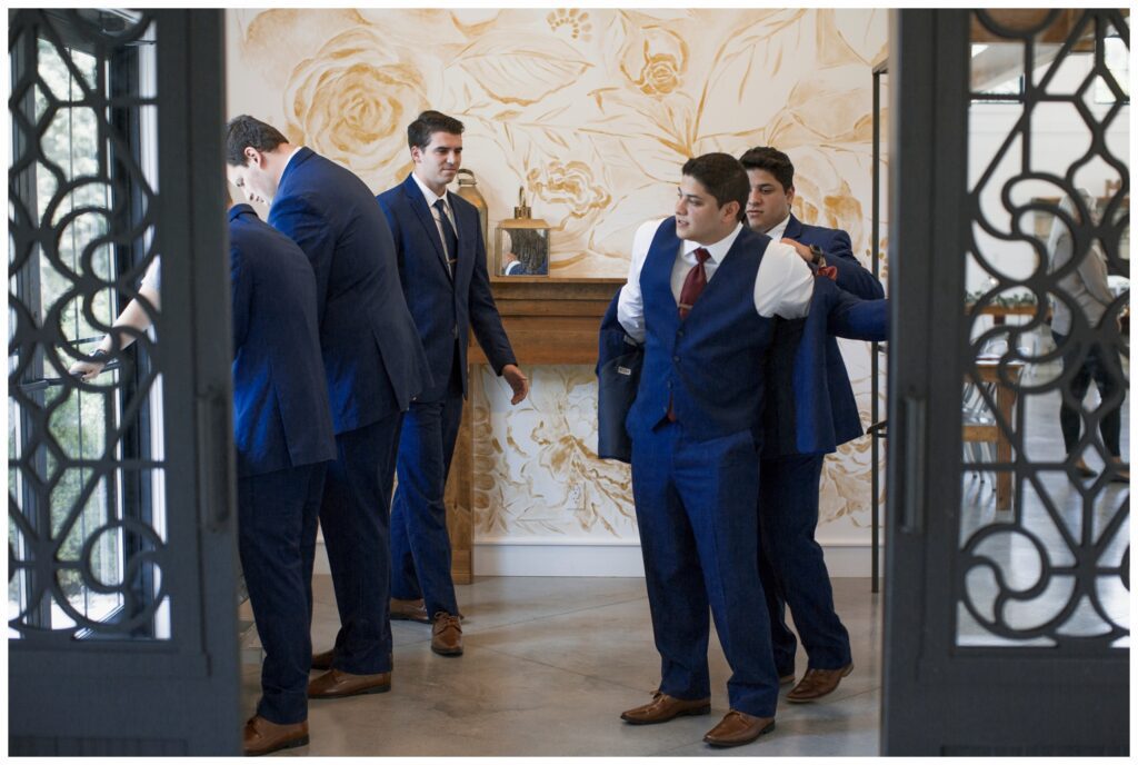 anyone who works with us can rest easy knowing we have taken care of everything., groomsmen getting ready