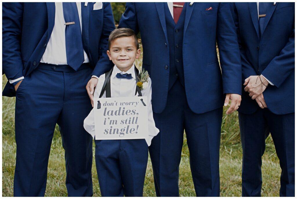 The Wilds Wedding Venue, Bloomington, Indiana, young ring bearer holding up sign "I'm still single ladies"