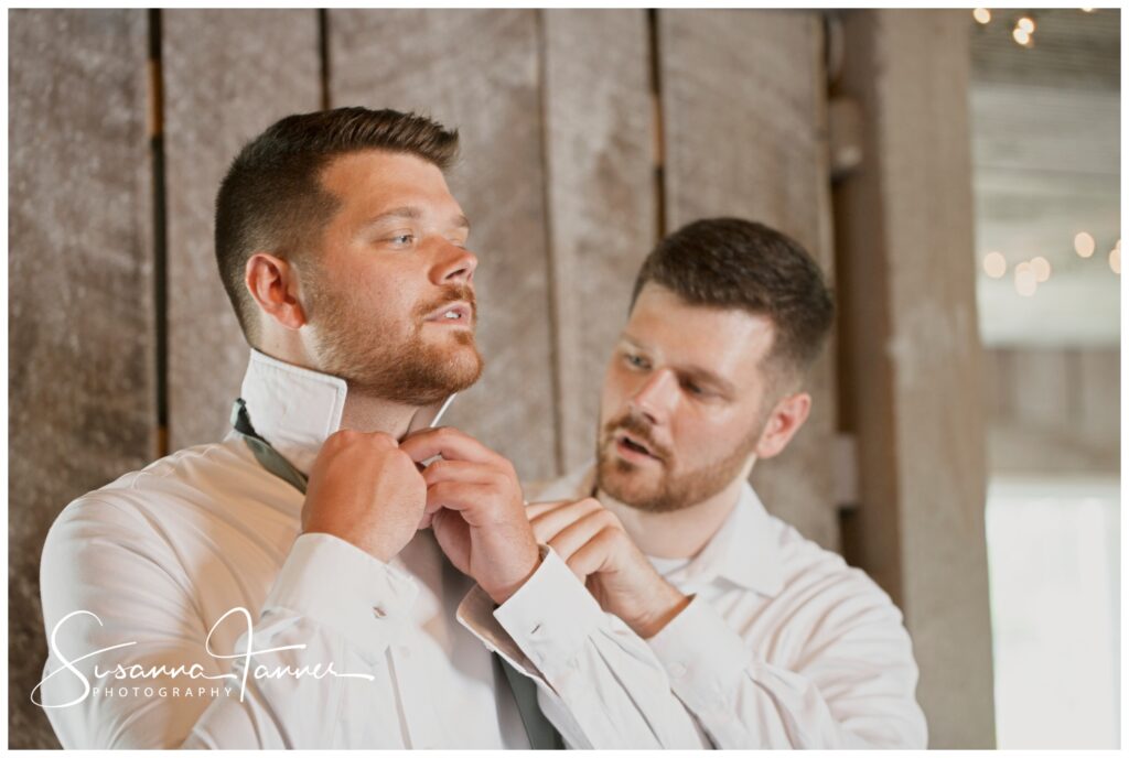 Laurel Mill Barn Wedding, best man (his identical twin) helping groom tie his neckware