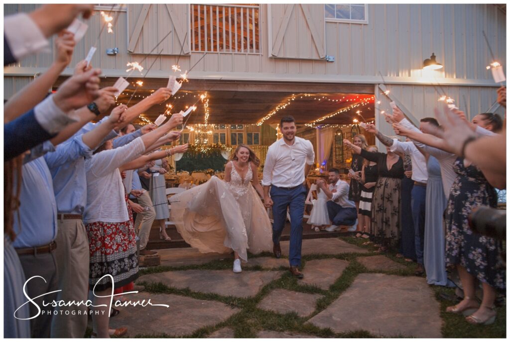 Laurel Mill barn wedding, Bloomington, IN, bride and groom run through sparkler send off