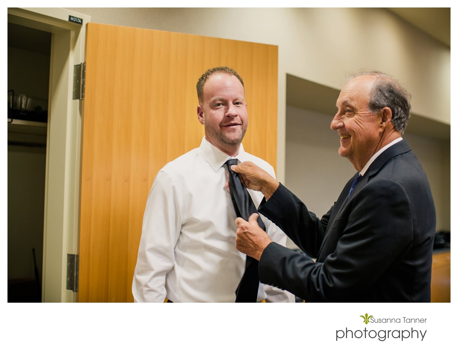 Indiana State Museum wedding photography, groom putting on tie with father 