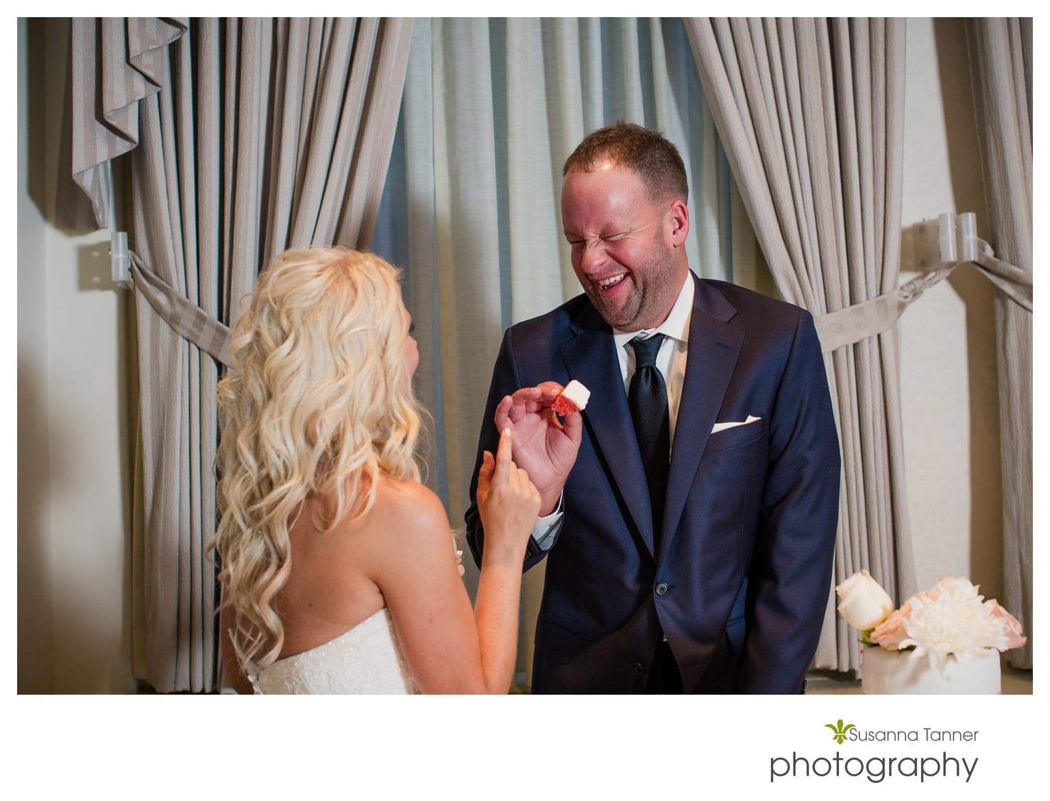 Indiana State Museum wedding photography, groom laughing while feeding bride cake