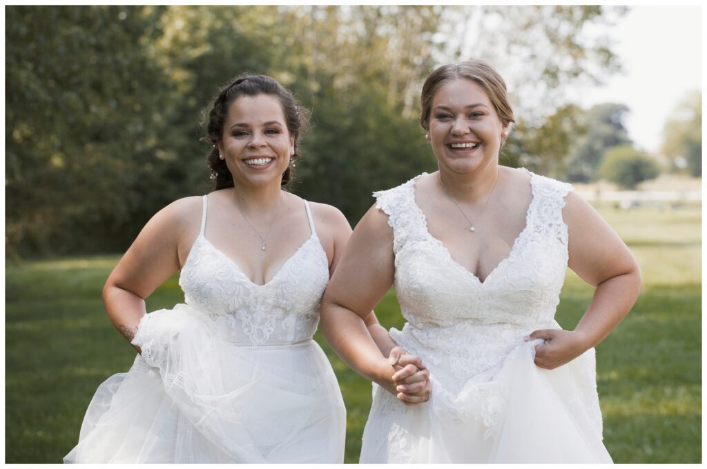gay wedding, outside portraits, two brides holding hands