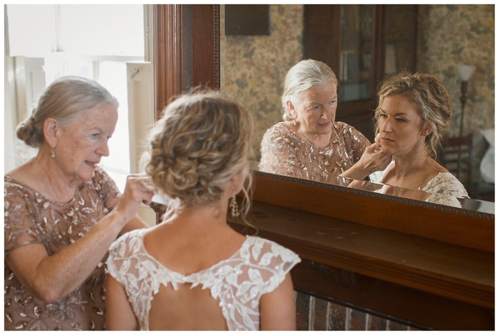 outdoor wedding venue, Richmond, IN, mother of bride helping bride with earrings